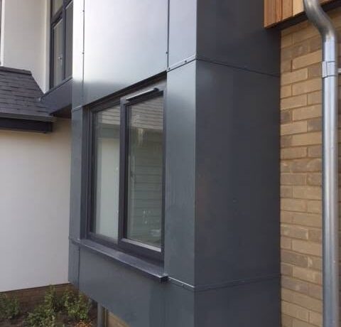 Powdercoated aluminium window cladding detail fitted to a brick facade