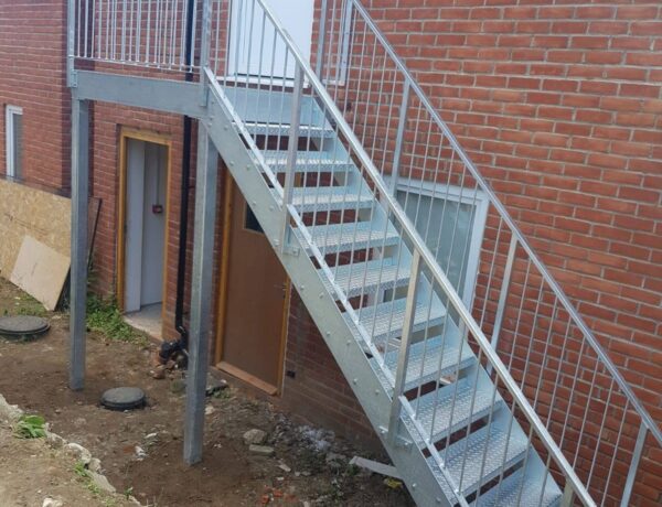 Galvanised steel external staircase with open treads, fabricated and installed by SAMS Fabrications