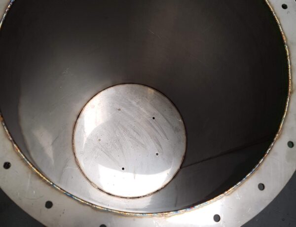 Interior of a welded stainless steel tank with circular access opening