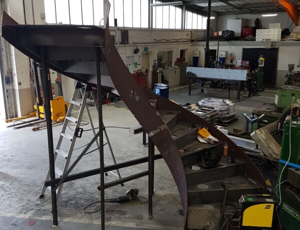 Curved steel staircase stringer under construction in the SAMS Fabrications workshop