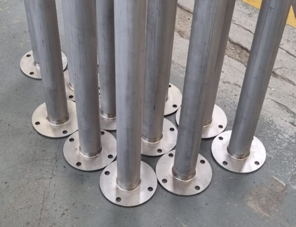 Group of stainless steel posts with welded base flanges