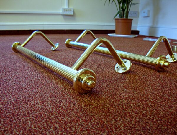 Polished brass handrails with ball finials