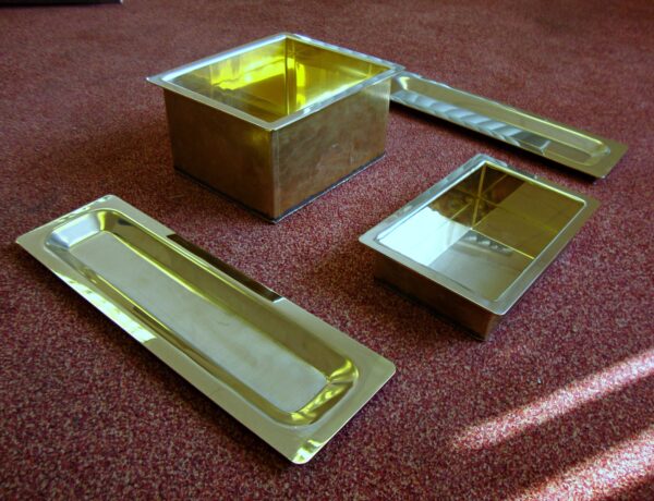 Polished brass trays and boxes