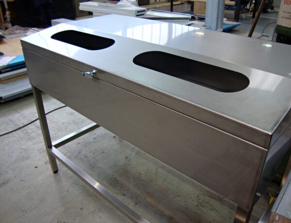Stainless steel cabinet top with cutouts and frame