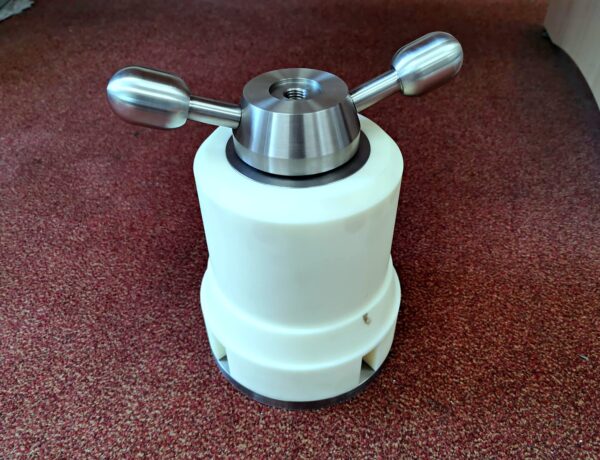 Machined nylon and steel clamp component