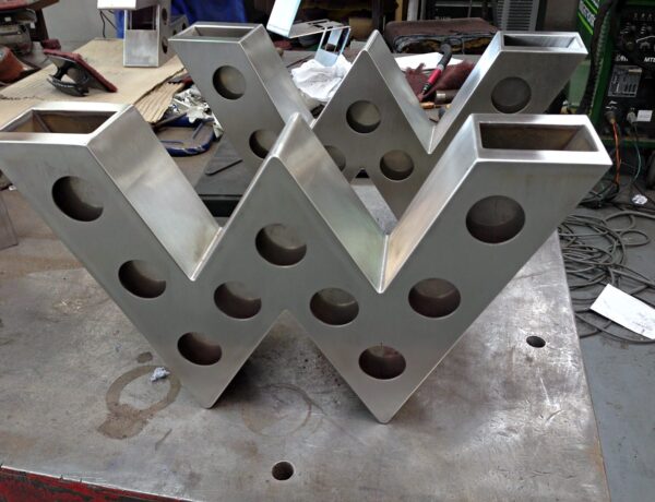 Stainless brushed finished W with punched holes