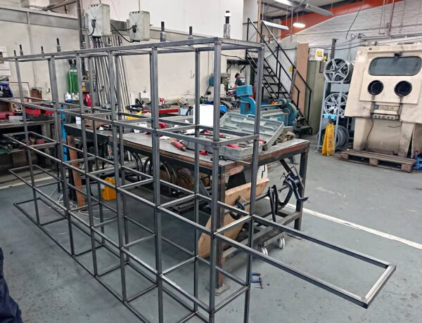 Welded mild steel cage frame under construction in the workshop