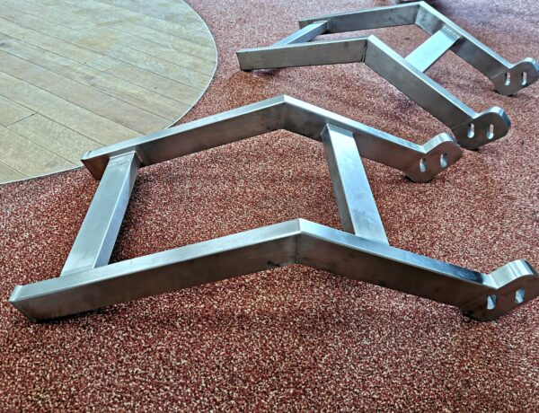 Polished stainless steel A-frame wall bracket supports