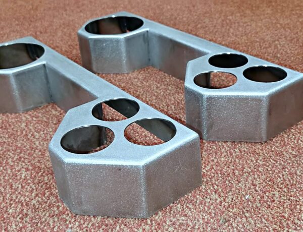 Sheet metal welded control covers with circular cutouts