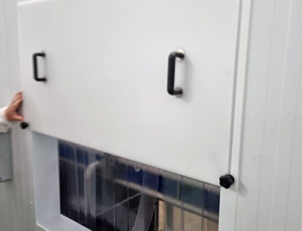 White sliding door fitted with black steel pull handles