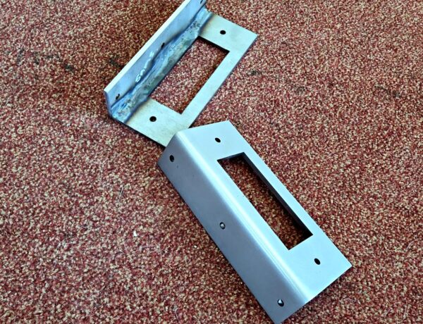 Welded mild steel bracket with slotted fixings