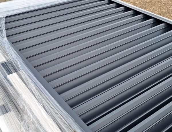 Stack of grey aluminium louvre panels ready for delivery