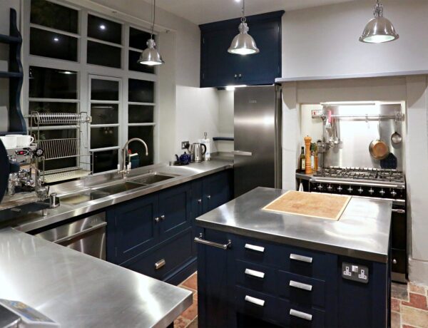 Stainless steel worktops installed in a domestic kitchen by SAMS Fabrications